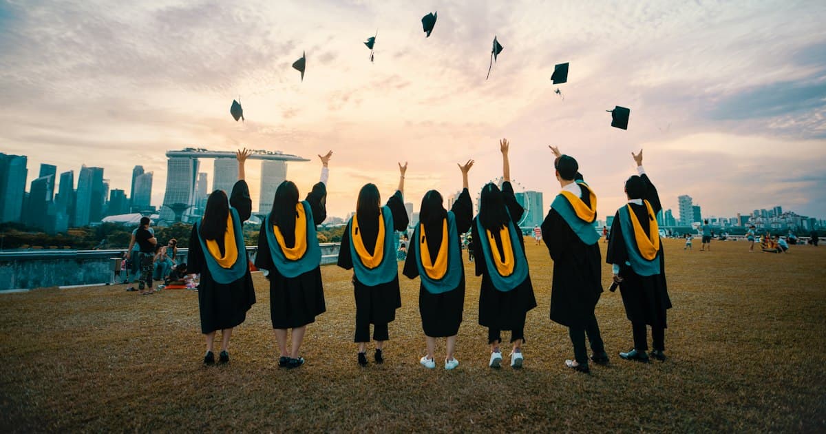Graduates throwing their caps